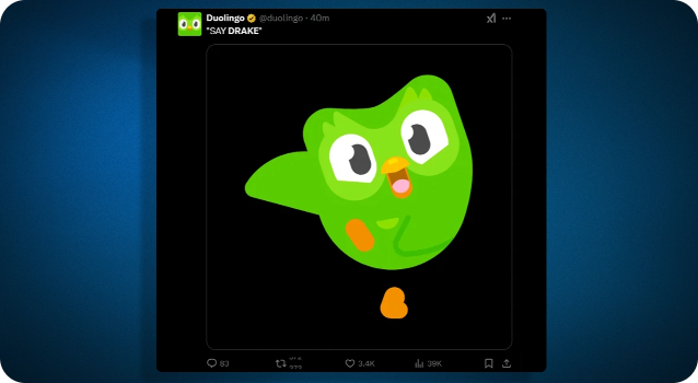Screenshot of Duolingo’s post on X trolling Drake, with the caption ‘Say Drake’ and a graphic of Duo the owl dancing. 